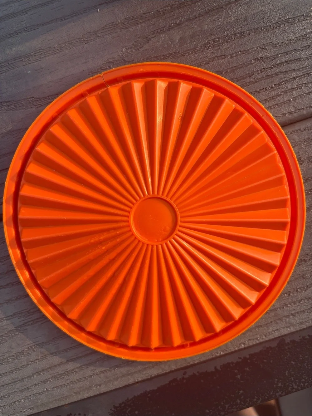 Tupperware Orange Storage Container with Decorative Emblem